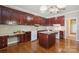 Kitchen featuring wood cabinets, a center island, and a white appliance package at 123 Shoreview Dr, Mooresville, NC 28117