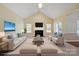 Virtually staged living room with fireplace, French doors, and stylish furniture arrangement at 123 Shoreview Dr, Mooresville, NC 28117