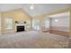 Open-concept living room featuring fireplace, French doors, and view into the dining area at 123 Shoreview Dr, Mooresville, NC 28117