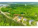 Aerial view of a house on an expansive lot surrounded by lush greenery and mature trees at 1336 W Rebound Rd, Indian Land, SC 29720