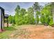 Large backyard with a mix of grassy and wooded areas, perfect for outdoor activities and privacy at 1336 W Rebound Rd, Indian Land, SC 29720