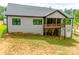 Exterior view of a home showcasing a covered wooden deck and a lawn area at 1336 W Rebound Rd, Indian Land, SC 29720