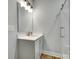 Bathroom with a modern vanity, mirror, light fixture and a walk in glass shower at 1336 W Rebound Rd, Indian Land, SC 29720