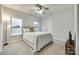 Comfortable bedroom with ceiling fan, carpet, and natural light from a large window at 1336 W Rebound Rd, Indian Land, SC 29720