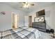 Spacious bedroom with a ceiling fan, television, neutral colors, and carpeted floor at 1336 W Rebound Rd, Indian Land, SC 29720