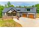 Beautiful two-story home featuring stone accents, two-car garage, and professionally landscaped front yard at 1336 W Rebound Rd, Indian Land, SC 29720