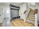 View of the foyer with convenient mudroom-style built-ins and a staircase leading to the upper level at 1336 W Rebound Rd, Indian Land, SC 29720