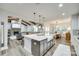 Modern kitchen island overlooks a spacious living room and dining area, perfect for entertaining at 1336 W Rebound Rd, Indian Land, SC 29720
