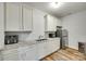 Additional Kitchen view showcases white cabinets, granite countertops, and stainless steel appliances at 1336 W Rebound Rd, Indian Land, SC 29720
