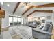 Inviting living room with vaulted ceiling, exposed beams, and a cozy seating arrangement at 1336 W Rebound Rd, Indian Land, SC 29720