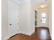Bright hallway with gleaming hardwood floors, neutral walls, white trim and doors, and recessed lighting at 1358 Cedardale Ln, Denver, NC 28037