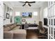 Inviting home office with dark wood floors, a sleek desk, and comfortable seating area at 1358 Cedardale Ln, Denver, NC 28037