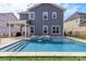 Backyard with a in-ground swimming pool, spa and green grass at 1358 Cedardale Ln, Denver, NC 28037