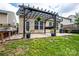 Backyard featuring a pergola, string lights, and an outdoor seating area at 13936 Mallard Lake Rd, Charlotte, NC 28262