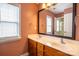 Dual sink bathroom with a large mirror and good natural lighting at 13936 Mallard Lake Rd, Charlotte, NC 28262
