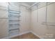 Walk-in closet with multiple shelves for ample storage at 13936 Mallard Lake Rd, Charlotte, NC 28262