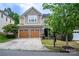 Inviting two-story home featuring a well-manicured lawn and a convenient two-car garage at 13936 Mallard Lake Rd, Charlotte, NC 28262