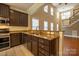 Well-appointed kitchen featuring granite counters, stainless steel appliances and breakfast bar at 13936 Mallard Lake Rd, Charlotte, NC 28262