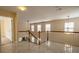 Open loft with marble floors, railing, and abundant natural light at 13936 Mallard Lake Rd, Charlotte, NC 28262