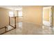 Open loft boasts marble floors, railing and views into the house at 13936 Mallard Lake Rd, Charlotte, NC 28262