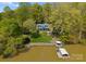 Breathtaking aerial view of a lake house with a private dock, boat slip, and lush surroundings at 1430 Mollys Backbone Rd, Catawba, NC 28609