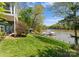 Scenic backyard featuring a well-manicured lawn and tranquil waterfront views of the lake at 1430 Mollys Backbone Rd, Catawba, NC 28609