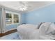Cozy bedroom with light blue walls and plenty of natural light at 1430 Mollys Backbone Rd, Catawba, NC 28609