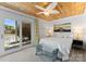 Bright bedroom features lake view, wood ceiling, sliding doors, and stylish glass top table at 1430 Mollys Backbone Rd, Catawba, NC 28609