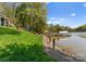 Stunning lakefront property featuring a well-maintained yard, wooden dock, and a covered boat slip perfect for outdoor enjoyment at 1430 Mollys Backbone Rd, Catawba, NC 28609