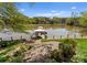 Picturesque view of private boat dock on the lake with charming seating under umbrella at 1430 Mollys Backbone Rd, Catawba, NC 28609