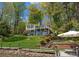 Beautiful lakefront home with a spacious yard, tiered landscaping, and a private dock for waterfront living at 1430 Mollys Backbone Rd, Catawba, NC 28609