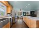 Open kitchen flowing into living room featuring modern stainless appliances and a large island at 1430 Mollys Backbone Rd, Catawba, NC 28609