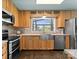 Modern kitchen with stainless steel appliances, bright cabinets, and stone backsplash at 1430 Mollys Backbone Rd, Catawba, NC 28609