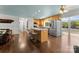 Bright eat-in kitchen featuring stainless steel appliances and a large island with seating, overlooking the lake at 1430 Mollys Backbone Rd, Catawba, NC 28609