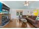 Cozy living room with stone fireplace and large comfortable sofa at 1430 Mollys Backbone Rd, Catawba, NC 28609
