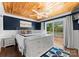 Cozy main bedroom with wooden ceiling, wainscoting, and lake views at 1430 Mollys Backbone Rd, Catawba, NC 28609