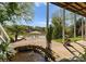 Outdoor patio offering serene lake view, landscaping, and cozy seating area at 1430 Mollys Backbone Rd, Catawba, NC 28609