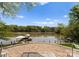 Charming brick patio overlooking a serene lake, offering a peaceful outdoor retreat and lovely water views at 1430 Mollys Backbone Rd, Catawba, NC 28609