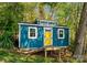 Charming shed has bright yellow door with dormer window and small deck at 1430 Mollys Backbone Rd, Catawba, NC 28609