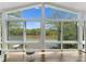 Bright sunroom with lake views and large windows to enjoy a view of the outdoors at 1430 Mollys Backbone Rd, Catawba, NC 28609