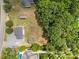 Aerial view of home on a large lot with established trees and a shed at 14532 E Rocky River Rd, Davidson, NC 28036