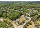 Aerial view of a neighborhood featuring mature trees at 14532 E Rocky River Rd, Davidson, NC 28036