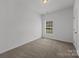 Empty bedroom with natural light at 14532 E Rocky River Rd, Davidson, NC 28036