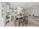 Open concept dining area seamlessly connects to the kitchen and living room creating a warm and inviting space at 14532 E Rocky River Rd, Davidson, NC 28036