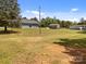 View of home with spacious lawn, shed, and wooded area at 14532 E Rocky River Rd, Davidson, NC 28036