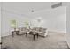 Expansive living room featuring neutral tones, two comfortable sofas, and ample space for gatherings at 14532 E Rocky River Rd, Davidson, NC 28036