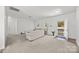 Open concept living room featuring carpet, light walls, and outside access at 14532 E Rocky River Rd, Davidson, NC 28036
