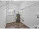Utility room with washer/dryer hookups and shelving at 14532 E Rocky River Rd, Davidson, NC 28036