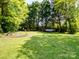 Picturesque backyard with a hammock, mature trees, and ample green space at 1506 Crestdale Rd, Rock Hill, SC 29732