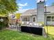 Cozy backyard patio with modern furniture and a well-maintained lawn at 1506 Crestdale Rd, Rock Hill, SC 29732